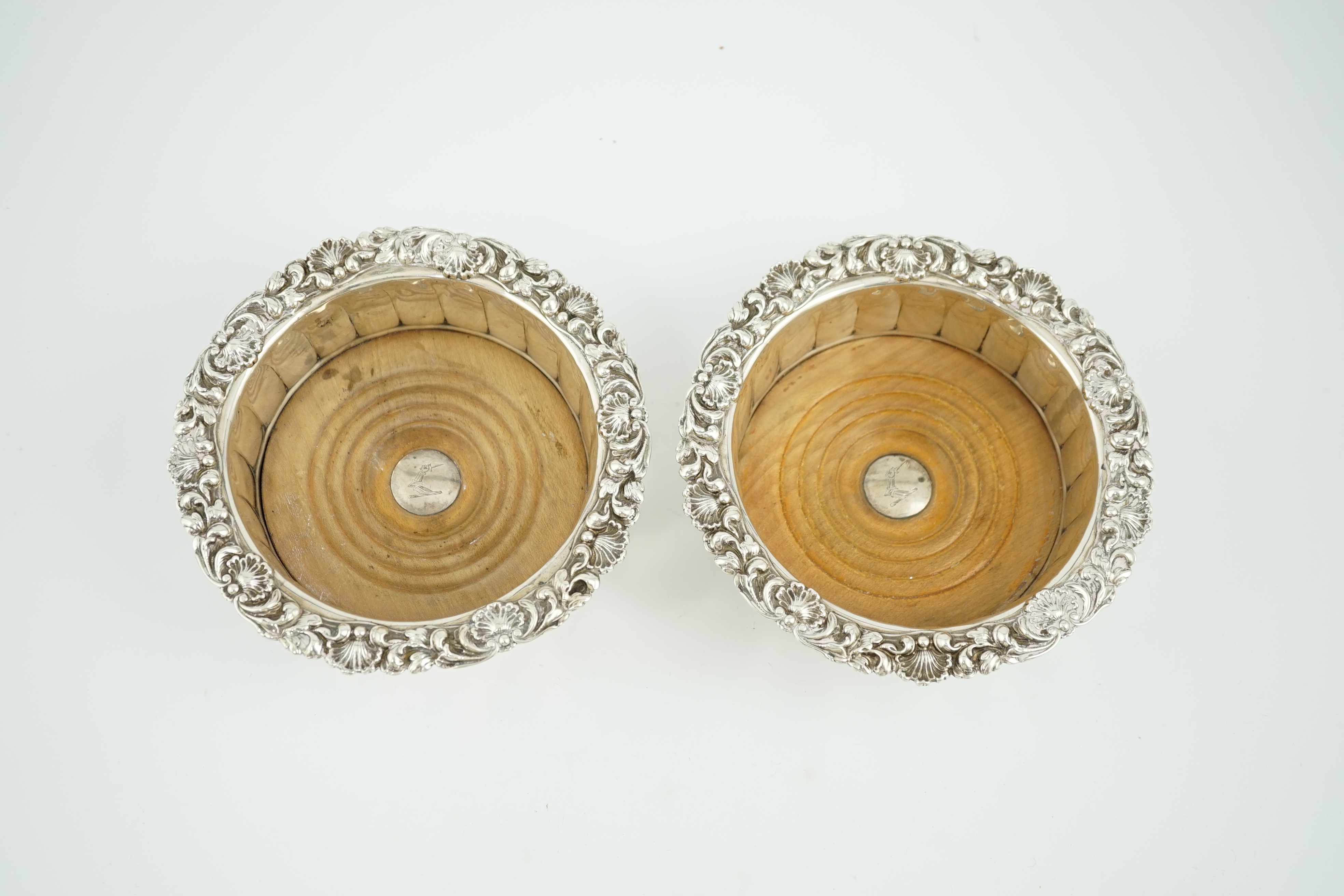 A pair of George III silver mounted wine coasters, by John & Thomas Settle Gunn & Co